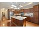 Well-appointed kitchen with granite counters, central island, and stainless steel appliances at 102 Mikaila Dr, Gibsonville, NC 27249