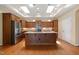 Stylish kitchen featuring a central island, granite countertops, and stainless steel appliances at 102 Mikaila Dr, Gibsonville, NC 27249