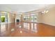 Open-concept living room with a cozy fireplace, natural light, and outdoor access at 102 Mikaila Dr, Gibsonville, NC 27249