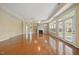 Sun-drenched living room with hardwood floors, fireplace, and door to patio at 102 Mikaila Dr, Gibsonville, NC 27249