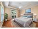 Staged main bedroom with a large bed, bedside tables, and a serene painting above the headboard at 102 Mikaila Dr, Gibsonville, NC 27249