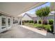 Covered patio features a concrete floor, access to the yard and screen porch, perfect for outdoor entertaining at 102 Mikaila Dr, Gibsonville, NC 27249