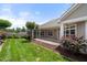 The covered patio provides a seamless transition to the outdoors, complete with a screened-in porch and grassy yard at 102 Mikaila Dr, Gibsonville, NC 27249