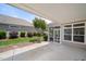 This covered patio offers views of the landscaped yard and access to a screened-in porch, great for relaxing outdoors at 102 Mikaila Dr, Gibsonville, NC 27249