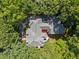 Aerial view of the home surrounded by lush greenery, showcasing its private and serene setting at 1105 Tazwell Pl, Raleigh, NC 27612
