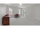 Large bedroom with gray walls, plush carpeting, and a dedicated office space at 1105 Tazwell Pl, Raleigh, NC 27612