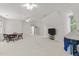 Bright bonus room with multiple windows, ceiling fans, and carpeted floors at 1105 Tazwell Pl, Raleigh, NC 27612