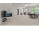 Bright bonus room with multiple windows, ceiling fans, and carpeted floors at 1105 Tazwell Pl, Raleigh, NC 27612