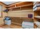 Organized closet with shelves, rods, and decorative wallpaper at 1105 Tazwell Pl, Raleigh, NC 27612
