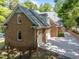 The home features a brick facade, attached garage, and a paved driveway complemented by well-maintained landscaping at 1105 Tazwell Pl, Raleigh, NC 27612