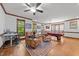 Bright game room with a pool table, leather chairs, and a built in desk at 1105 Tazwell Pl, Raleigh, NC 27612