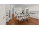 Bright kitchen with island, seating and stainless appliances at 1105 Tazwell Pl, Raleigh, NC 27612