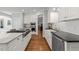 Bright kitchen featuring a large island, professional-grade appliances, and stylish cabinetry at 1105 Tazwell Pl, Raleigh, NC 27612