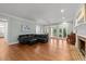 Spacious living room with hardwood floors, fireplace, and large windows offers a comfortable and stylish area at 1105 Tazwell Pl, Raleigh, NC 27612