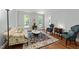 Bright living room with hardwood floors, neutral walls, and large windows creates a warm and inviting atmosphere at 1105 Tazwell Pl, Raleigh, NC 27612