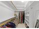 Spacious walk-in closet with custom shelves and ample storage space at 1105 Tazwell Pl, Raleigh, NC 27612