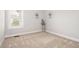Inviting bedroom featuring a window, neutral carpet, and stylish decor at 1109 Hemby Ridge Ln, Morrisville, NC 27560