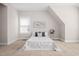 Bright bedroom features neutral carpet, a decorative painting, and window providing natural light at 1109 Hemby Ridge Ln, Morrisville, NC 27560