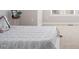 Bedroom featuring a bed with a decorative quilt and a small side table at 1109 Hemby Ridge Ln, Morrisville, NC 27560