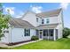 Back of home with a screened in porch, neutral vinyl siding, and green grass at 1109 Hemby Ridge Ln, Morrisville, NC 27560