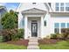 Close-up of the front entrance, showcasing the decorative wreath, tidy landscaping, and welcoming doorway at 1109 Hemby Ridge Ln, Morrisville, NC 27560