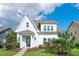 Charming two-story home boasts manicured lawn, flowerbeds, and a welcoming front entrance with decorative wreath at 1109 Hemby Ridge Ln, Morrisville, NC 27560