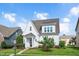 Charming two-story home boasts manicured lawn, flowerbeds, and a welcoming front entrance with decorative wreath at 1109 Hemby Ridge Ln, Morrisville, NC 27560