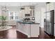Modern kitchen with stainless steel appliances, granite counters and white cabinetry at 1109 Hemby Ridge Ln, Morrisville, NC 27560