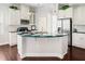 Kitchen features stainless steel appliances, granite counters, and custom white cabinetry at 1109 Hemby Ridge Ln, Morrisville, NC 27560