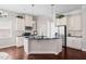 Modern kitchen with stainless steel appliances, granite counters and white cabinetry at 1109 Hemby Ridge Ln, Morrisville, NC 27560
