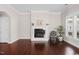 Bright living room featuring hardwood floors, fireplace, and large windows for natural light at 1109 Hemby Ridge Ln, Morrisville, NC 27560