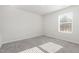 Bright bedroom with plush carpeting and a sunny window at 1113 Umstead Grove Way, Durham, NC 27712