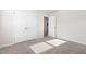 Bedroom featuring double door closet and neutral carpet at 1113 Umstead Grove Way, Durham, NC 27712