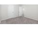 Neutral bedroom with carpet flooring, and a doorway leading to another room at 1113 Umstead Grove Way, Durham, NC 27712