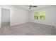 Bedroom featuring two windows and a ceiling fan at 1113 Umstead Grove Way, Durham, NC 27712