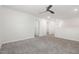 Spacious bonus room featuring neutral carpeting, a ceiling fan, and plenty of natural light at 1113 Umstead Grove Way, Durham, NC 27712