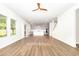 Open-concept living room flows into a modern kitchen with gray cabinets and a large center island at 1113 Umstead Grove Way, Durham, NC 27712