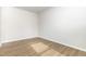Empty room featuring light wood floors and natural light from a window, waiting for personalization at 1113 Umstead Grove Way, Durham, NC 27712