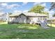 Exterior of home showcasing the spacious backyard, deck, and lush lawn at 112 Avent Pines Ln, Holly Springs, NC 27540