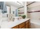 Bathroom featuring a single sink vanity, a bathtub, and tile flooring at 112 Avent Pines Ln, Holly Springs, NC 27540