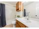 Cozy bathroom features a vanity with sink, toilet, and shower-tub combo at 112 Avent Pines Ln, Holly Springs, NC 27540