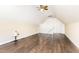 Spacious bonus room offers wood flooring, vaulted ceiling, and natural lighting at 112 Avent Pines Ln, Holly Springs, NC 27540