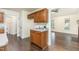 Additional kitchen area with laminate countertop, storage, and hardwood style floors at 112 Avent Pines Ln, Holly Springs, NC 27540