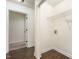 Bright laundry room features hardwood floors, utility sink, and plenty of storage space at 112 Avent Pines Ln, Holly Springs, NC 27540