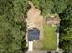Aerial view of the property showcasing the new home, driveway, and surrounding landscaping within a serene wooded setting at 113 Pueblo Dr, Louisburg, NC 27549