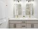 Bathroom featuring quartz countertops, double vanity, and gold fixtures at 113 Pueblo Dr, Louisburg, NC 27549