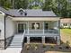 Charming home with a inviting front porch and well-maintained landscaping at 113 Pueblo Dr, Louisburg, NC 27549