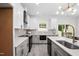 Modern kitchen with a large island, sleek countertops, and stainless steel appliances offers a functional workspace at 113 Pueblo Dr, Louisburg, NC 27549