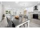 Spacious open concept kitchen features modern appliances, a large island and a connected dining area at 113 Pueblo Dr, Louisburg, NC 27549