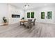 Bright living room featuring a modern fireplace, stylish seating, and ample space for relaxation and entertaining at 113 Pueblo Dr, Louisburg, NC 27549